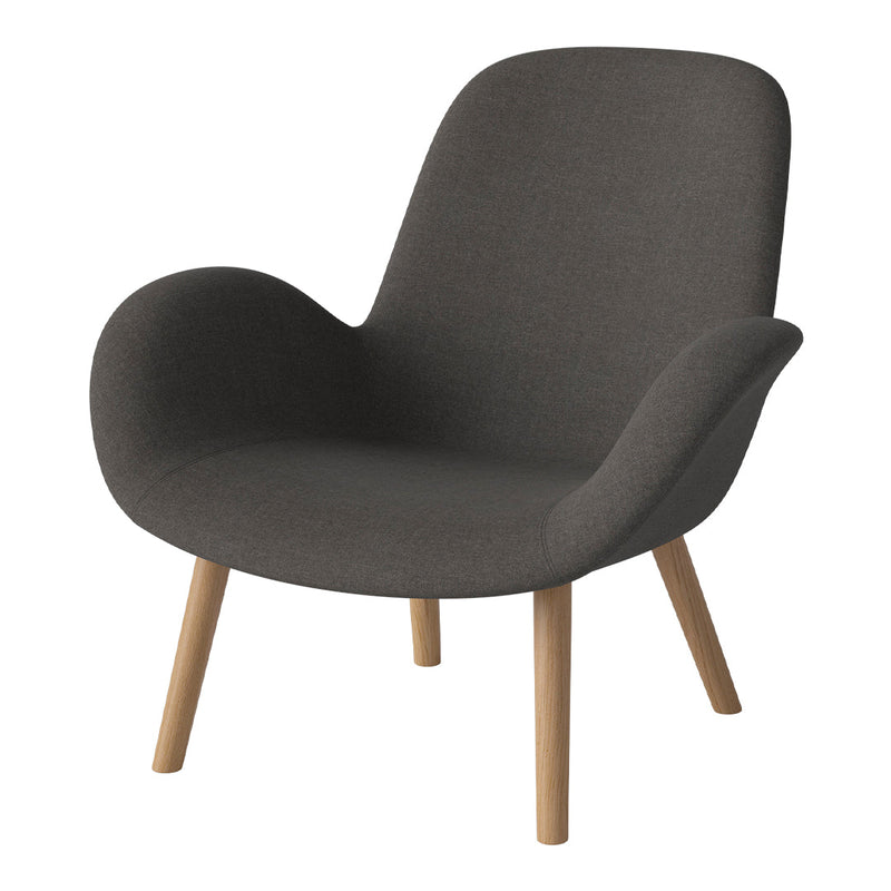 Cozy dark gray fabric armchair with light wood legs, featuring smooth, modern curves. Perfect for contemporary decor.