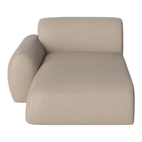 Beige modern chaise lounge with smooth leather texture and minimalist design, perfect for contemporary decor.