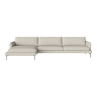 Modern light beige sectional sofa with smooth, minimalist design and plush cushions, set on sleek metal legs.