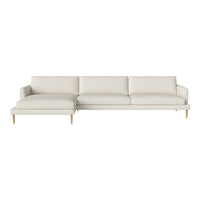 Light beige sectional sofa with a smooth texture and modern minimalist design, featuring soft cushions and wooden legs.