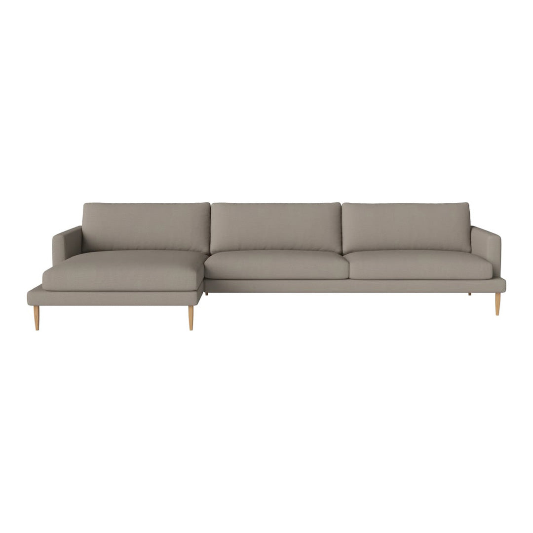 Contemporary sectional sofa in soft taupe fabric with clean lines and light wooden legs, perfect for modern decor.