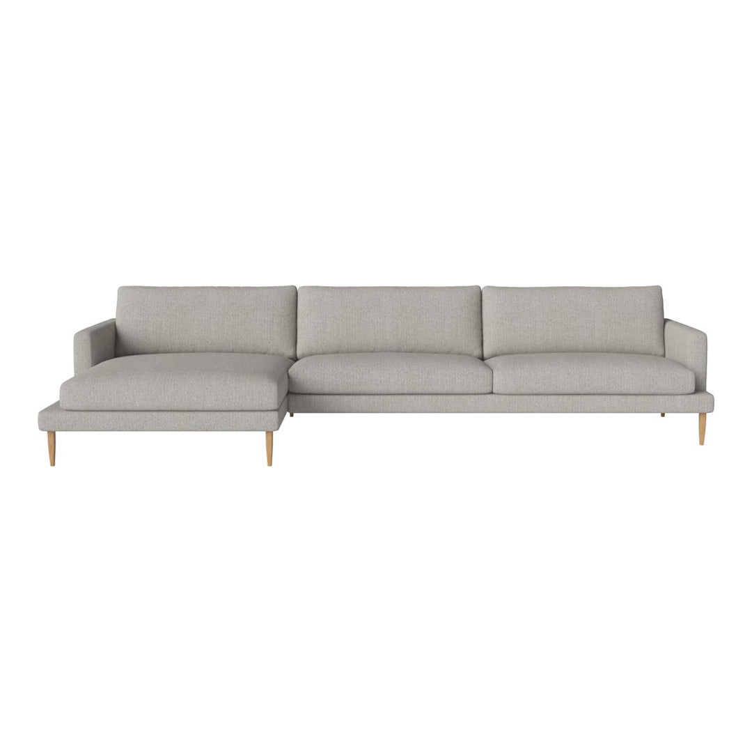 Light gray modern sectional sofa with simple lines and soft fabric, featuring a minimalist design and wooden legs.