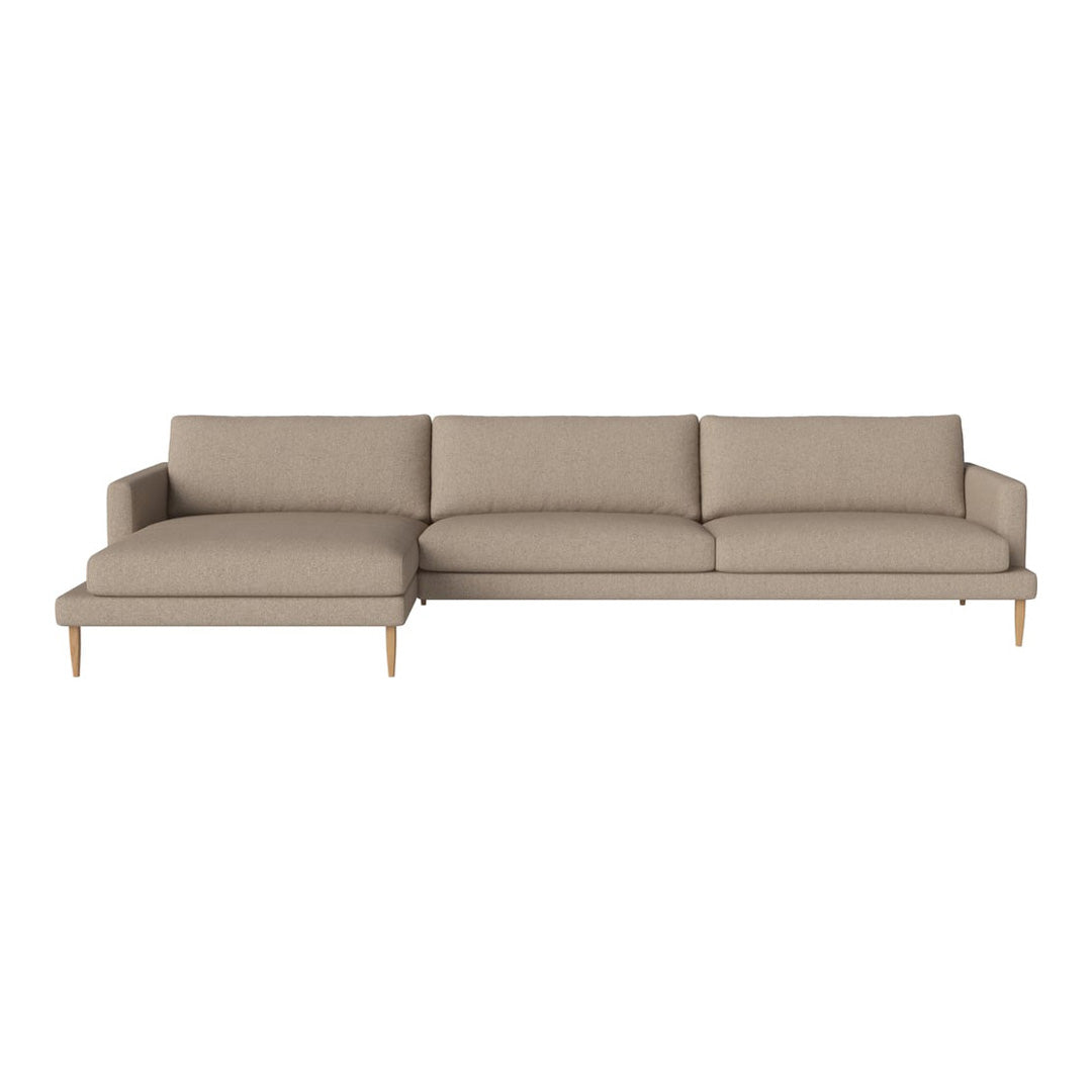 Beige upholstered sectional sofa with a simple, modern design and light wooden legs. Perfect for any living space.