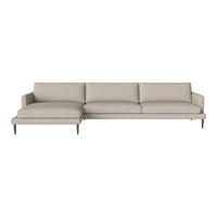 Light beige sectional sofa with solid, contemporary design and plush cushions for a modern living room.