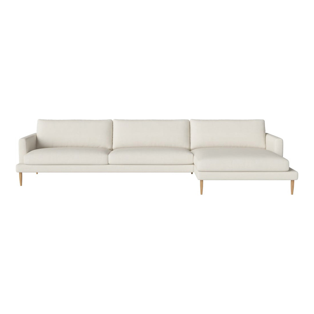 Light cream sofa with a sleek design and smooth fabric, featuring simple lines and natural wooden legs.