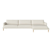 Light cream sofa with a sleek design and smooth fabric, featuring simple lines and natural wooden legs.