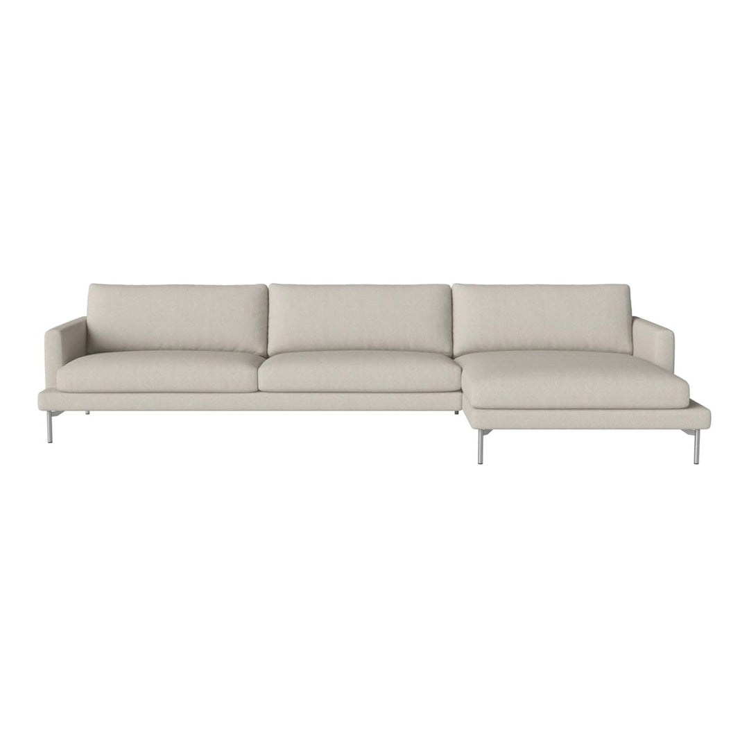 Light beige sectional sofa with smooth, minimalist design and plush cushions on a sleek silver base.