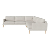 Light gray sectional sofa with clean lines and minimalist design, featuring plush cushions and wooden legs.