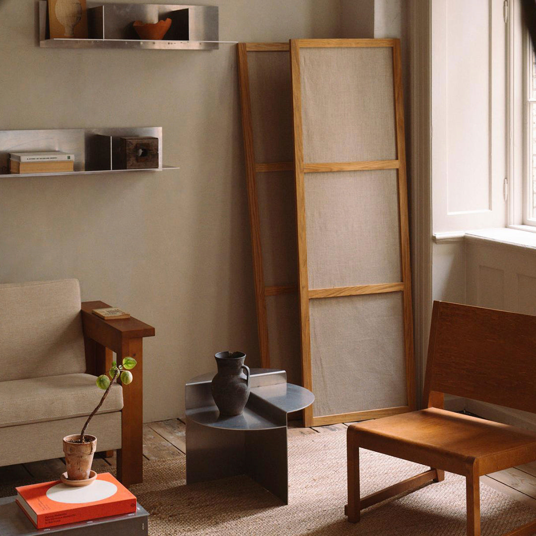 "Neutral tones with warm wood textures and minimalist patterns in a cozy living space."