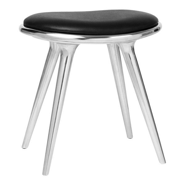 Black upholstered stool with sleek silver legs, featuring a modern, minimalist design.