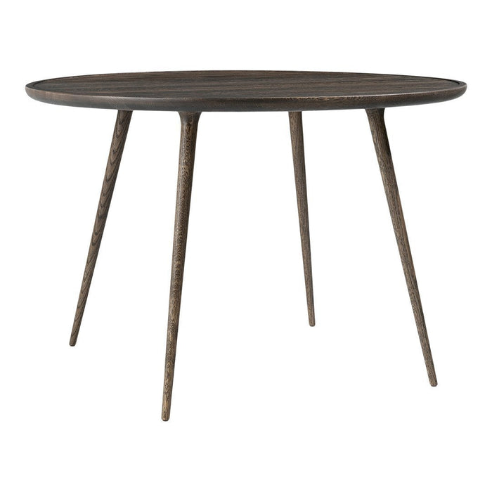 Round dark wood table with minimalist design and natural grain pattern. Sleek, tapered legs add an elegant touch.