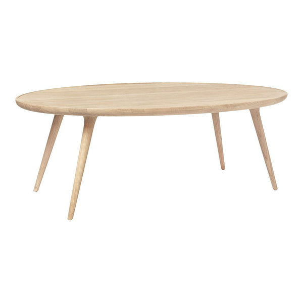 Light natural wood oval coffee table with a smooth finish and tapered legs, showcasing a minimalist Scandinavian design.