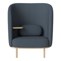Modern dark blue upholstered chair with minimalist design, featuring smooth curves and light wood accents.