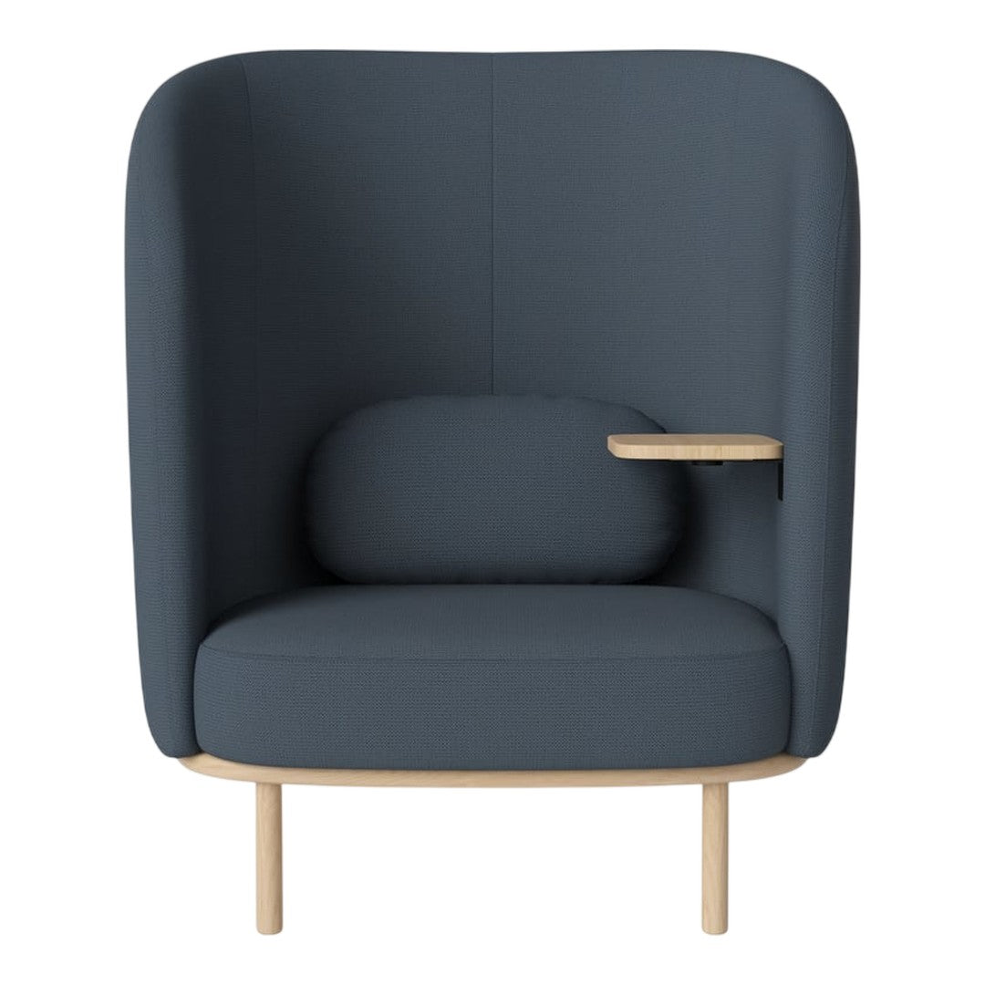 Dark blue upholstered armchair with smooth lines and a natural wood base, featuring a cushioned back and side table.