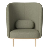 Green upholstered armchair with a modern textural pattern and light wooden legs, featuring a rounded lumbar cushion.