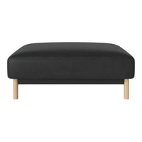 Black upholstered ottoman with natural wooden legs, featuring a sleek, minimalist design.