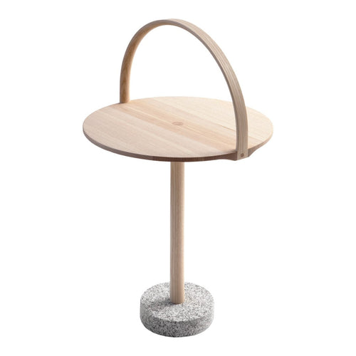 Natural wood table with a round light wood top and a textured gray concrete base, featuring a curved wooden handle.