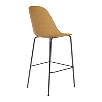 Tan upholstered bar stool with a smooth, curved seat and black metal legs. Simple and modern design.