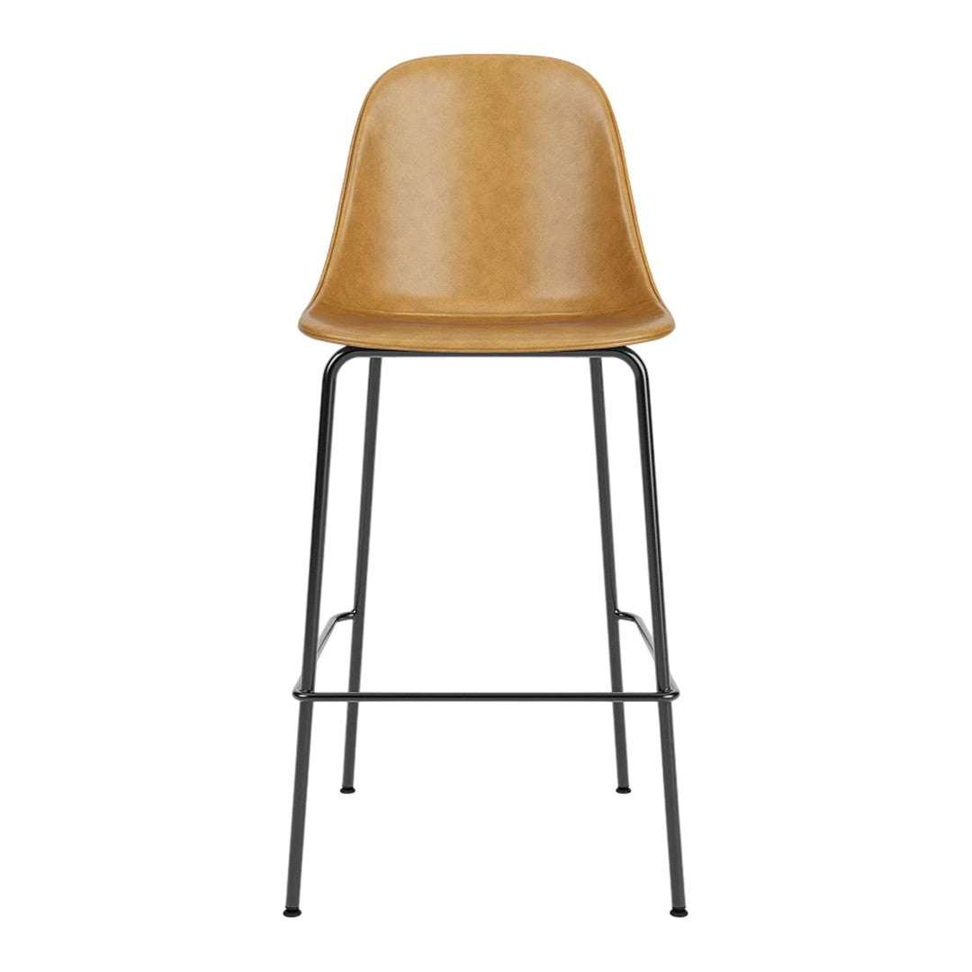 Tan bar stool with a smooth finish and sleek black metal legs, perfect for modern decor.