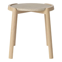 Light wood legs with a natural finish support a round, gray stone top, creating a modern and minimalist look.
