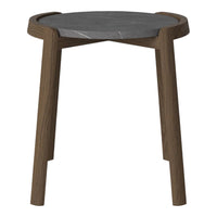 Round table with a sleek black marble top and warm wooden legs, showcasing a modern and elegant design.