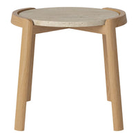Light wood stool with a round gray concrete top, showcasing a minimalist design and natural textures.
