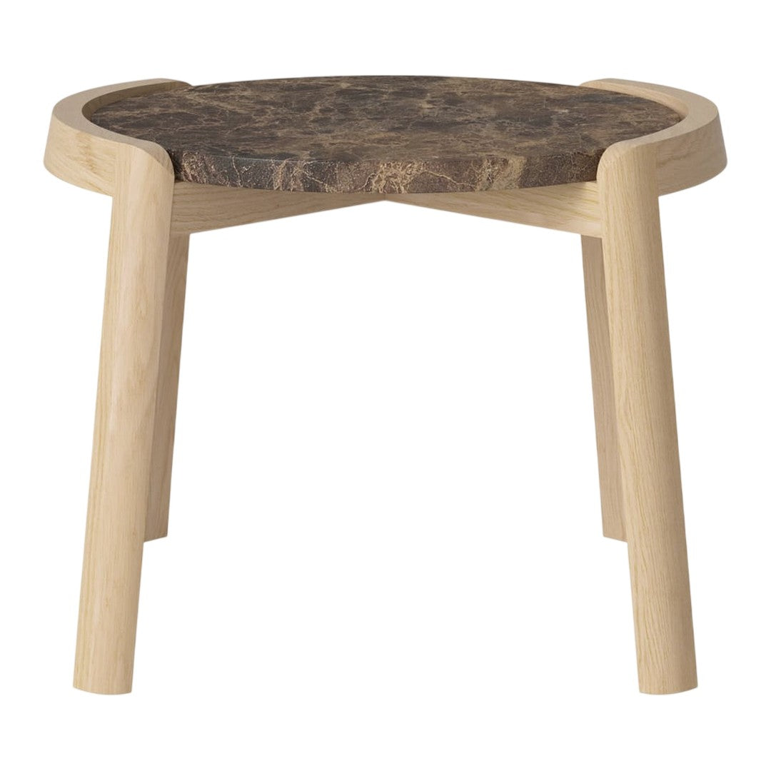Natural wood stool with a light wooden frame and a dark, patterned top. Modern, minimalist design.