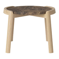 Natural wood stool with a light wooden frame and a dark, patterned top. Modern, minimalist design.