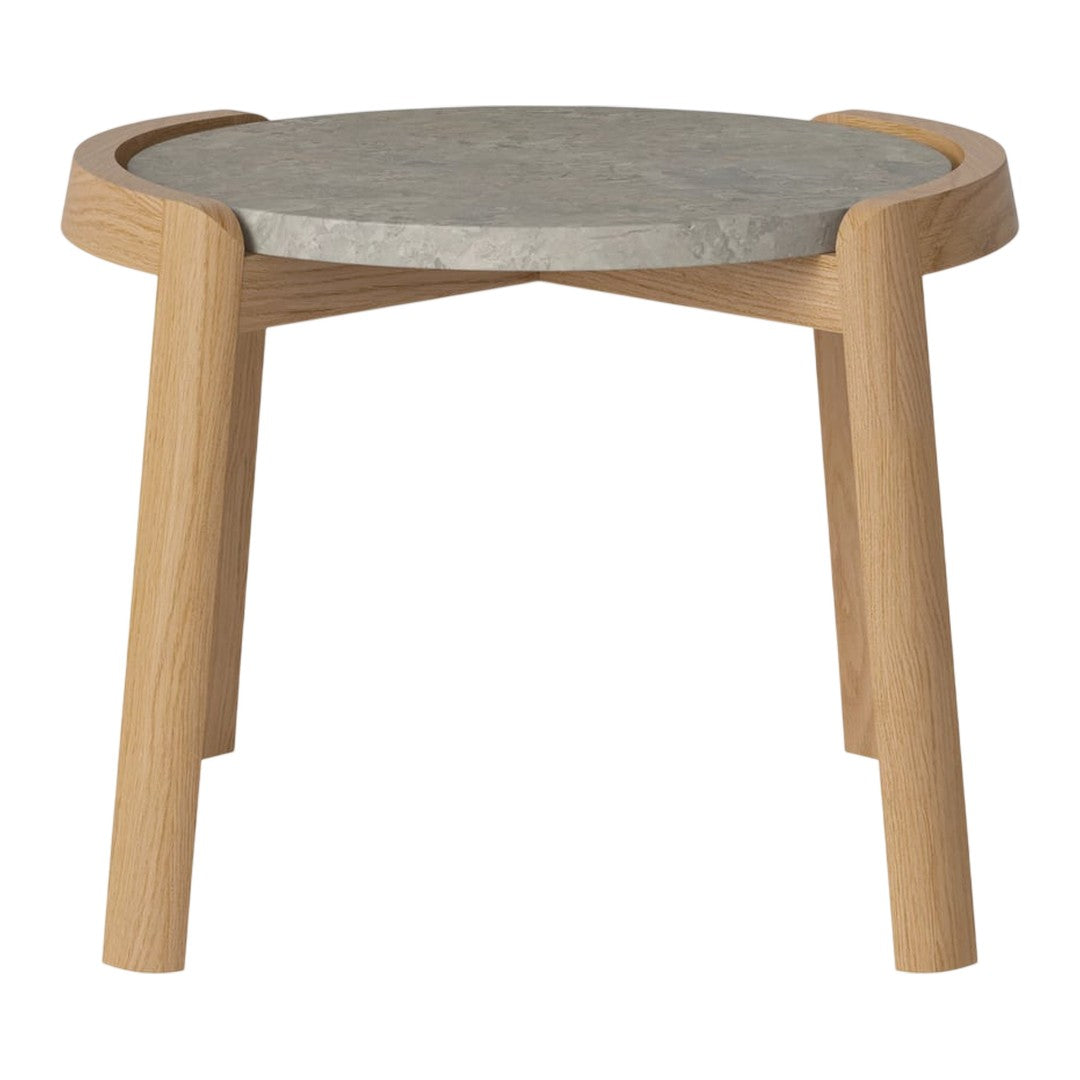 Light wood legs support a round gray concrete top, featuring a minimalistic, contemporary design.