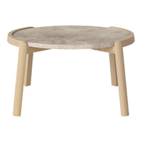 Round coffee table with a light wood base and a marbled gray tabletop, showcasing a modern minimalist design.