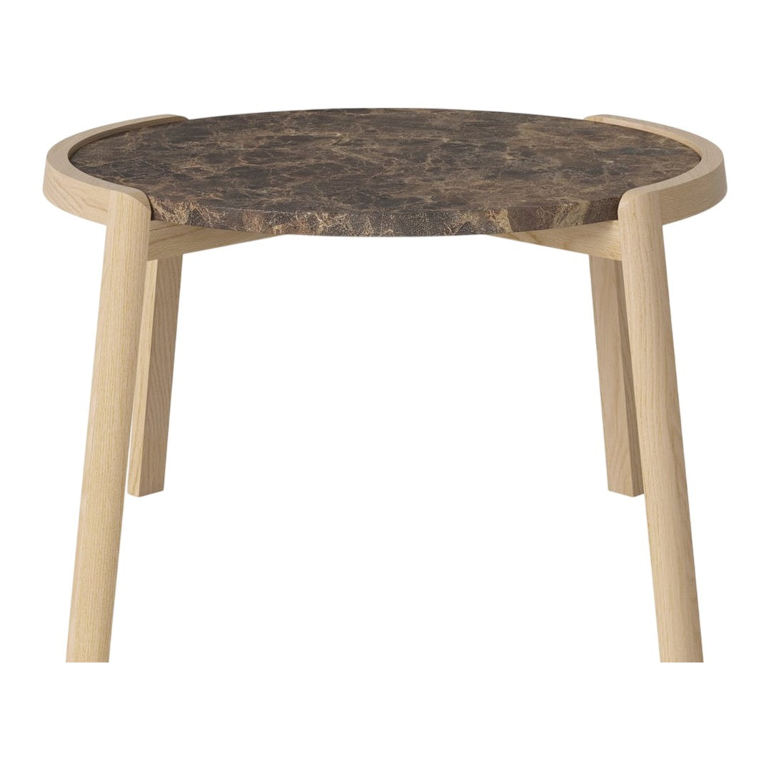 Round table with a dark patterned top and light wooden legs, perfect for modern decor.
