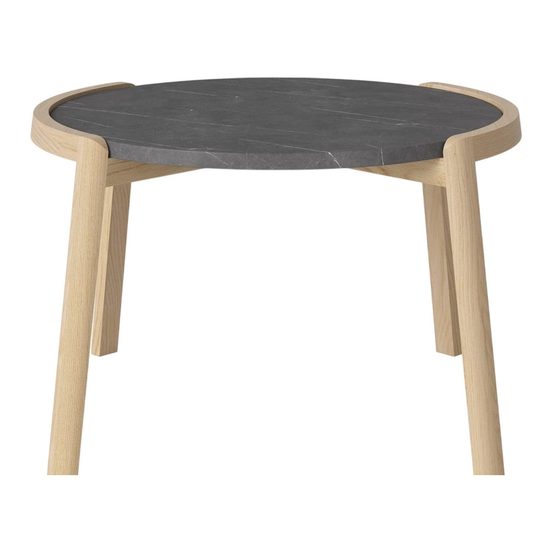 Round table with a sleek black stone top and natural wooden legs in a minimalist design.