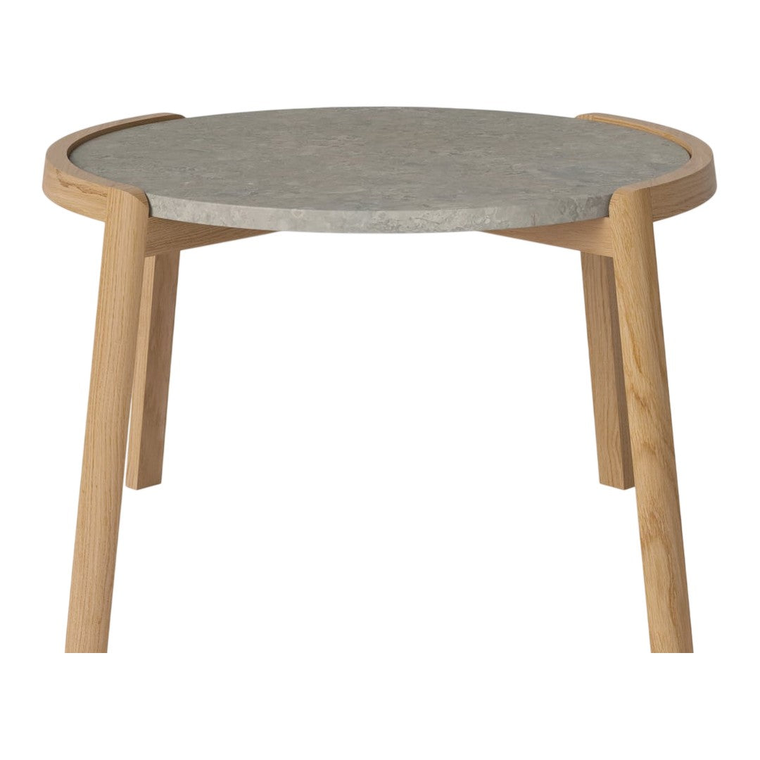 Round table with a gray patterned top and light wooden legs, showcasing a modern, minimalist design.