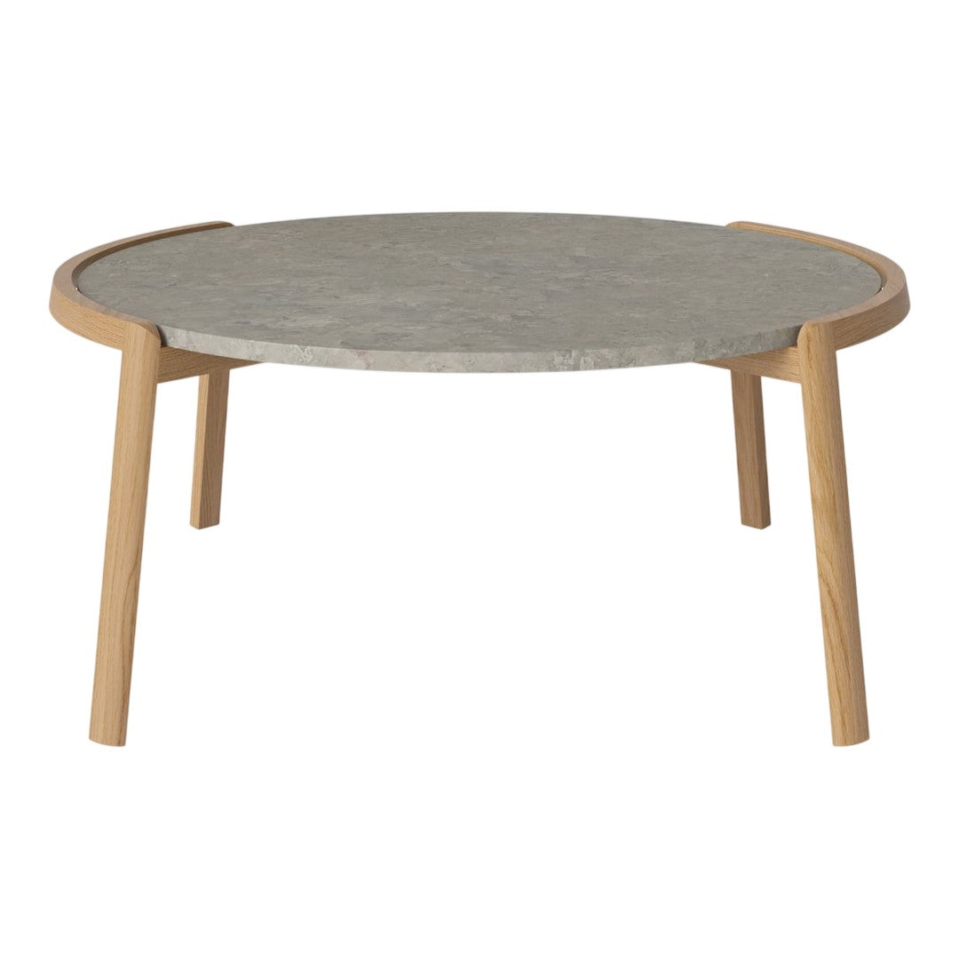 Round coffee table with a light wood frame and a smooth grey stone top, featuring a minimalist design.