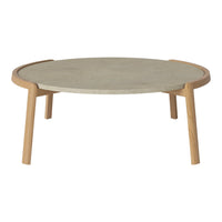 Gray circular tabletop with a smooth finish and natural wood legs, creating a minimalist and modern look.