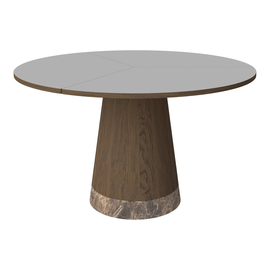 Round dining table with a grey top, dark wood base, and marble accent. Modern design with clean lines and elegant patterns.