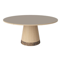 Round beige table with a smooth gray top and a wooden base featuring a dark marble accent. Minimalist design.