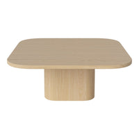 Light wood square coffee table with rounded edges and a smooth finish, featuring a minimalist design and neutral color palette.
