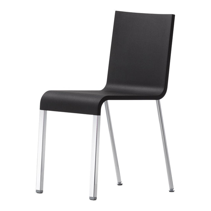Sleek black chair with a minimalist design and chrome legs, perfect for modern decor.