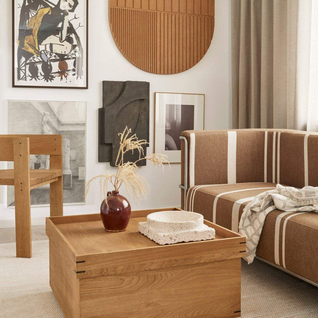 Warm wood tones with beige and brown striped patterns create a cozy, modern living space aesthetic.