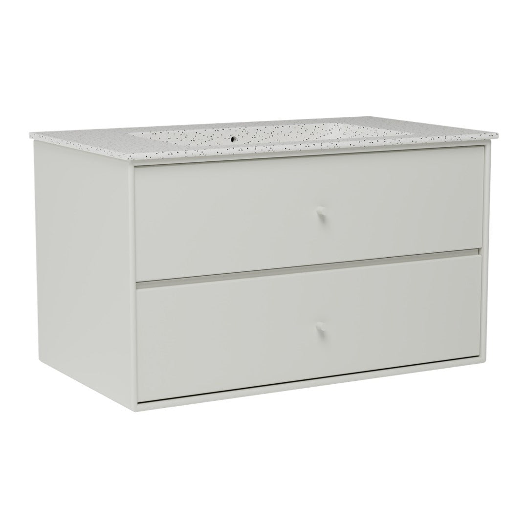 Light grey dresser with a textured white countertop and simple drawer design, perfect for modern decor.