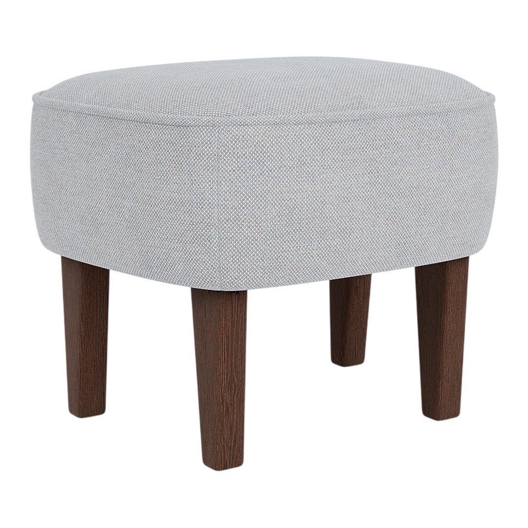 Light gray upholstered ottoman with a smooth texture and dark wooden legs, adding a modern touch to any space.
