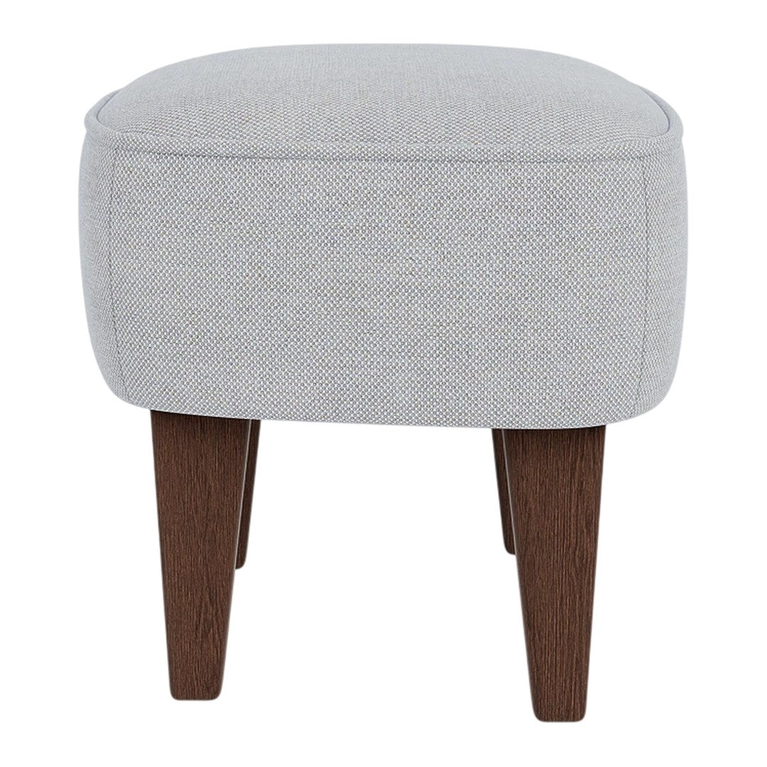 Gray upholstered ottoman with a textured pattern and dark wooden legs. Simple, modern design for versatile decor.