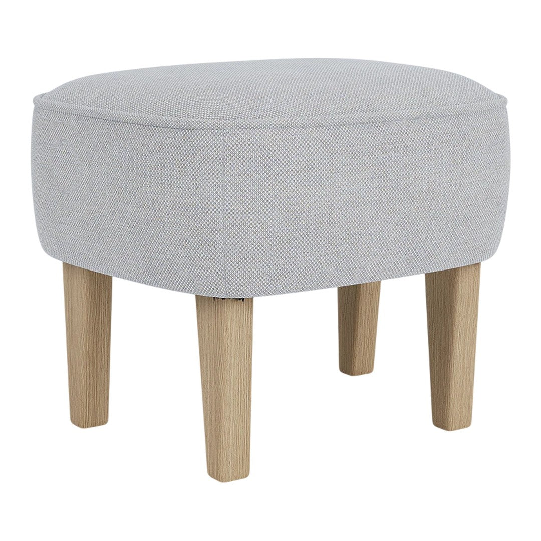 Light gray upholstered ottoman with natural wood legs, featuring a smooth, minimalist design.