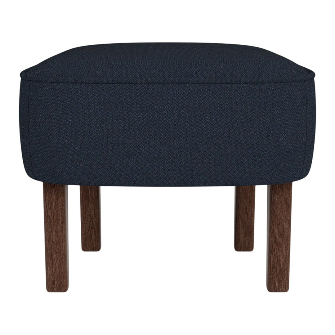 Navy blue upholstered ottoman with sleek edges and natural wood legs, featuring a minimalist design.