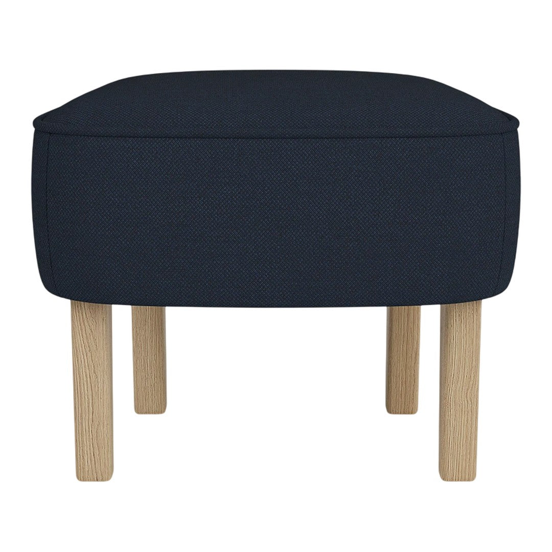 Dark blue upholstered ottoman with light wood legs, featuring a sleek, minimalist design. Perfect for modern decor.