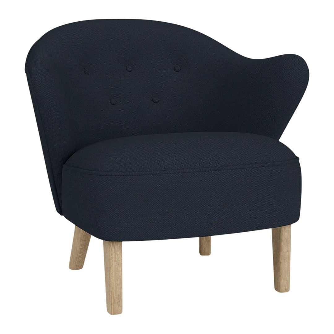 Elegant navy blue chair with a curved back, button-tufted detail, and natural wood legs for a modern look.