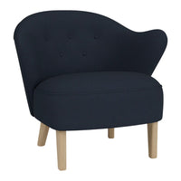 Elegant navy blue chair with a curved back, button-tufted detail, and natural wood legs for a modern look.