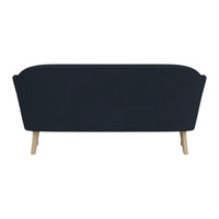 Navy blue sofa with a streamlined design and light wooden legs, perfect for modern decor.