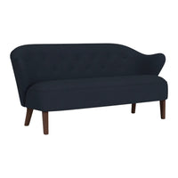 Navy blue sofa with a tufted fabric design and sleek wooden legs, featuring a stylish curved backrest.